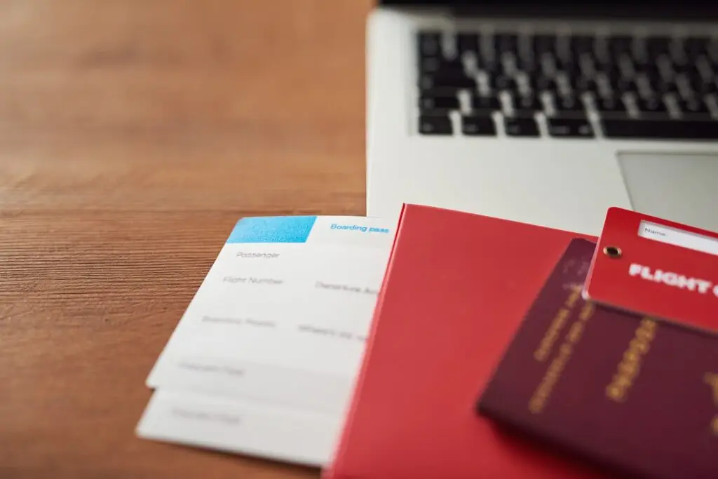 Hard work deserves a vacation. Shot of travel documents and a laptop on a table.