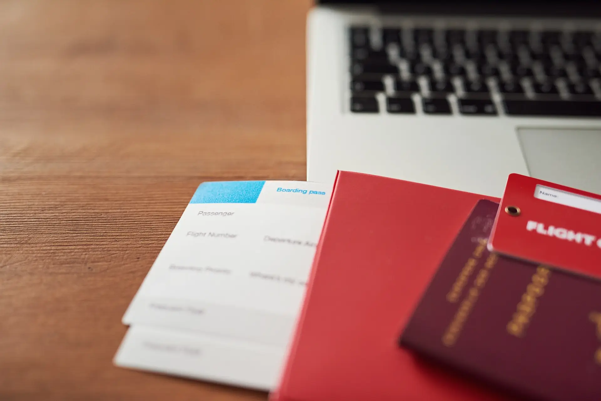 Hard work deserves a vacation. Shot of travel documents and a laptop on a table.